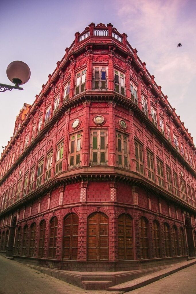 Intricate red sandstone carvings on the facade of Rampuria Haveli in Bikaner